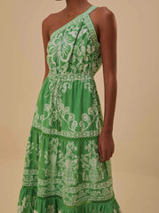bright green printed dress with one shoulder strap and tiered ruffle skirt