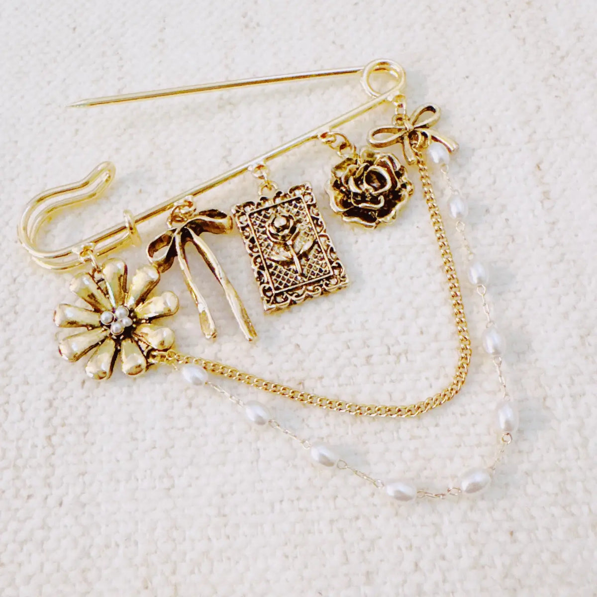 Floral Ribbon Pin Brooch – Elegant Gold Safety Pin with Charms and Pearl Chains