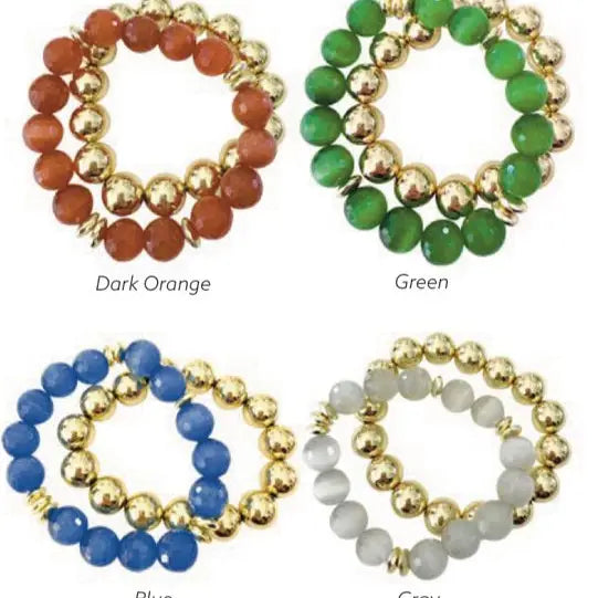 Four beaded bracelets in different colors with gold accents on a white background.