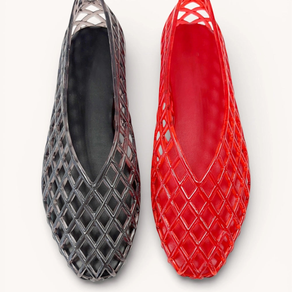 Black and red flat shoes with lattice design on a white background