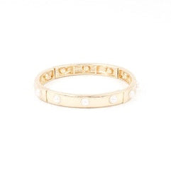 Gold bracelet on a white background