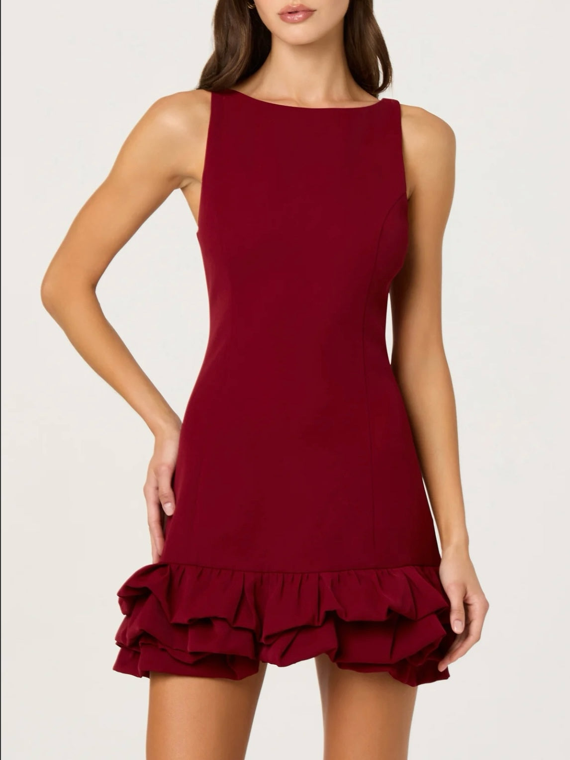 Red dress with ruffled hem on a white background