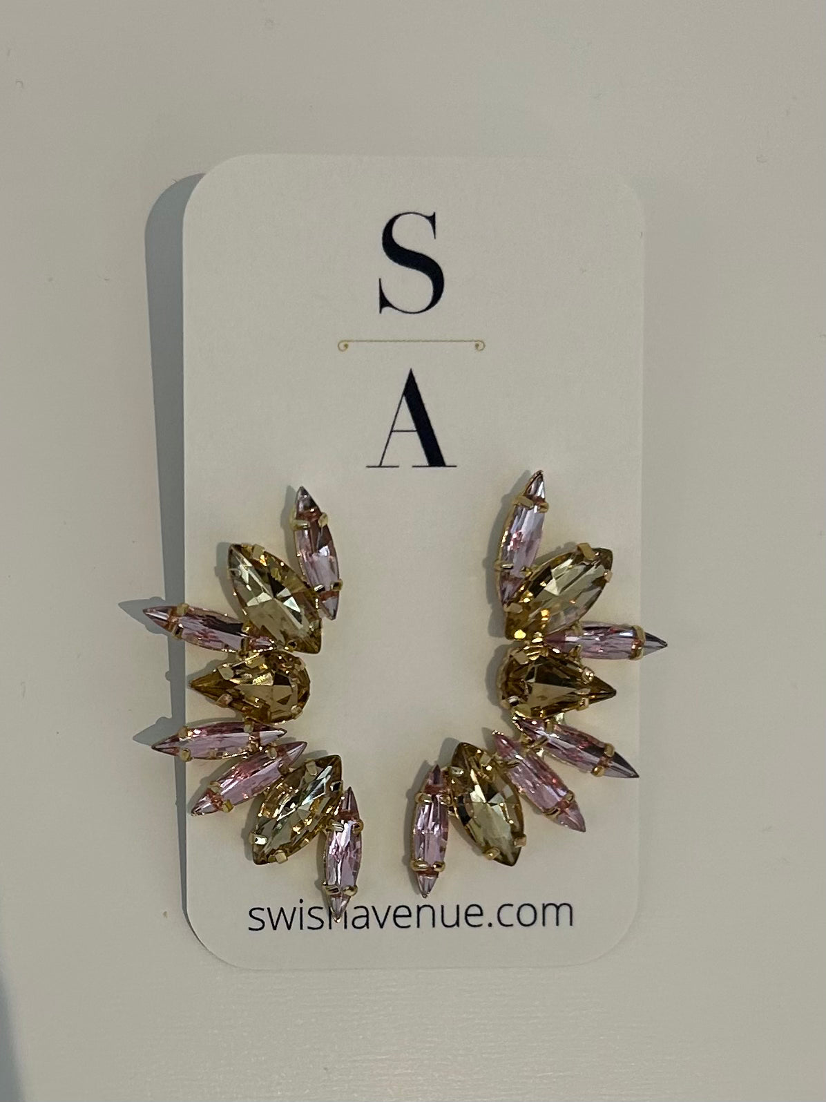 Pair of earrings on a card with 'S A' branding and 'swishavenue.com' text.