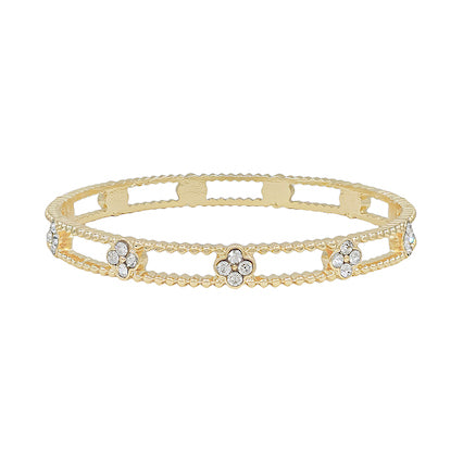 Gold bracelet with floral designs on a white background