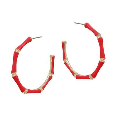 Red hoop earrings with gold accents on a white background