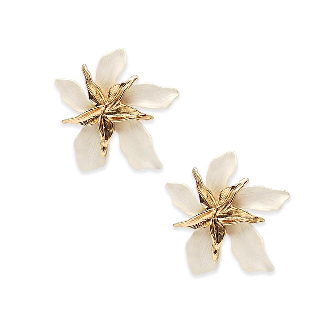 Pair of floral earrings with gold and white details on a white background
