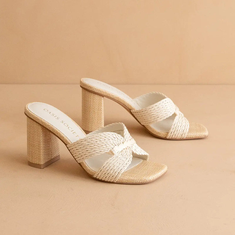Woven sandals with a block heel on a beige background