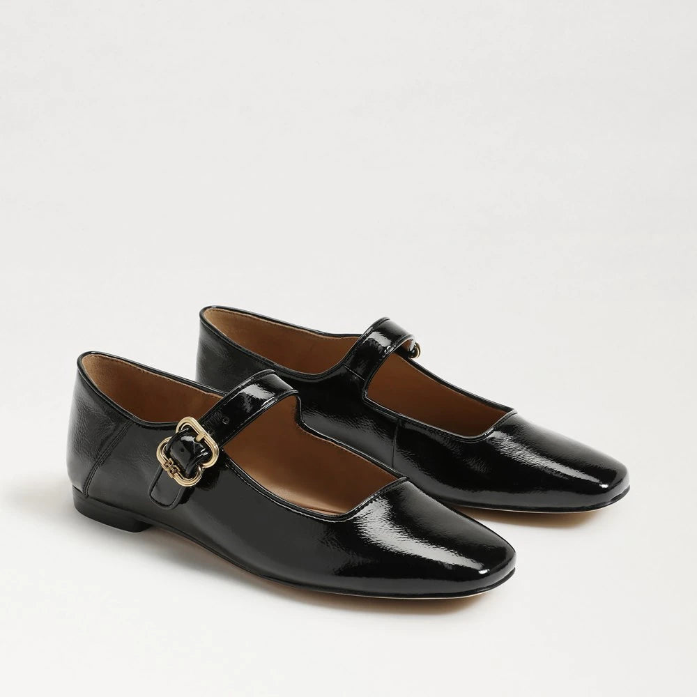 black patent leather mary jane shoes with gold buckles